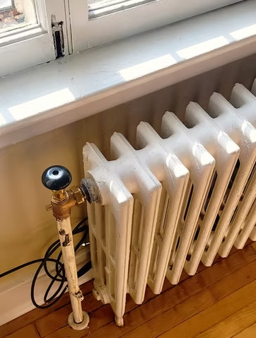 Classic cast iron radiator in a Kingston home